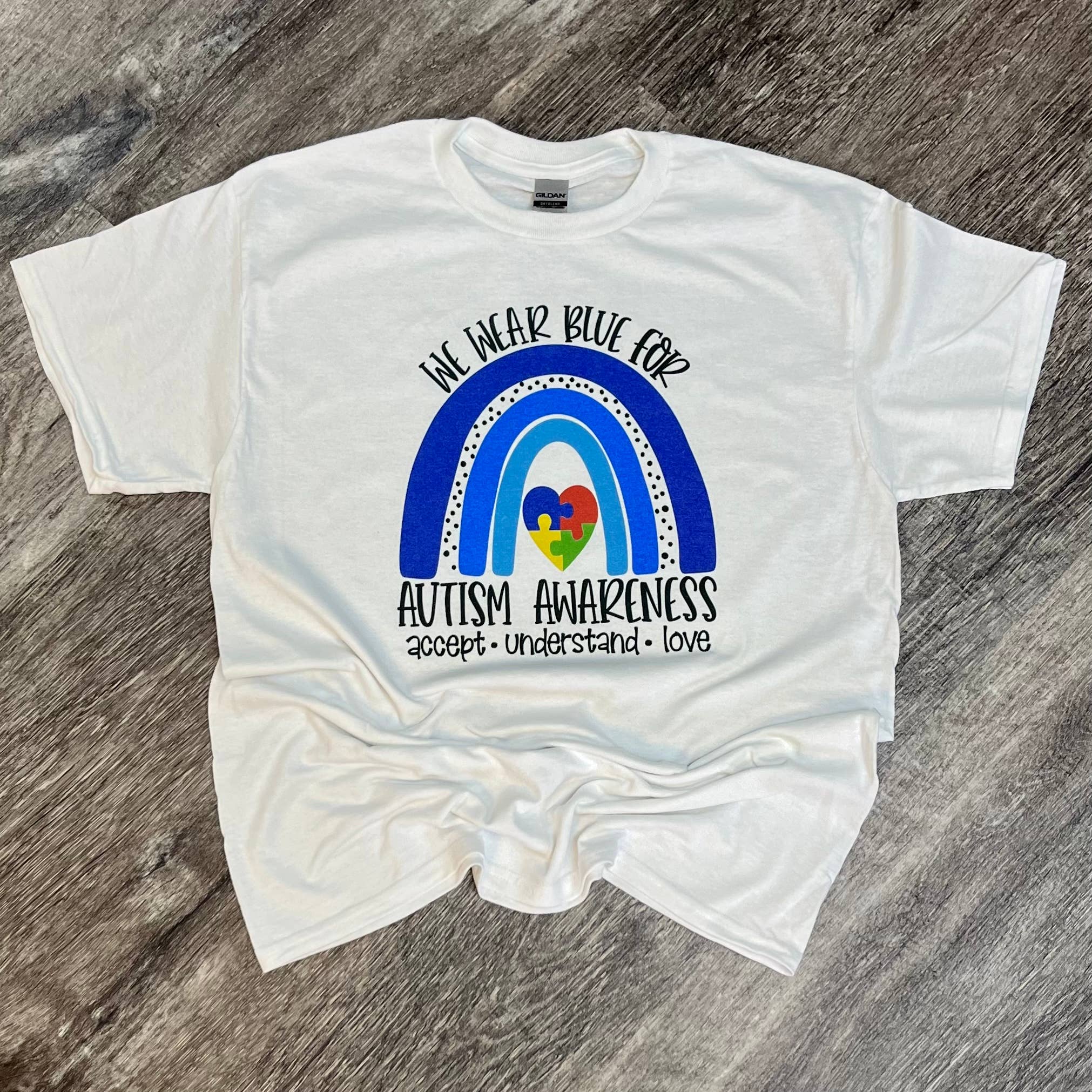 We Wear Blue For Autism Awareness On White Tee