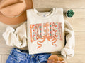 Cozy Season Bow Dark Cream Seasonal Fall Graphic Sweatshirt