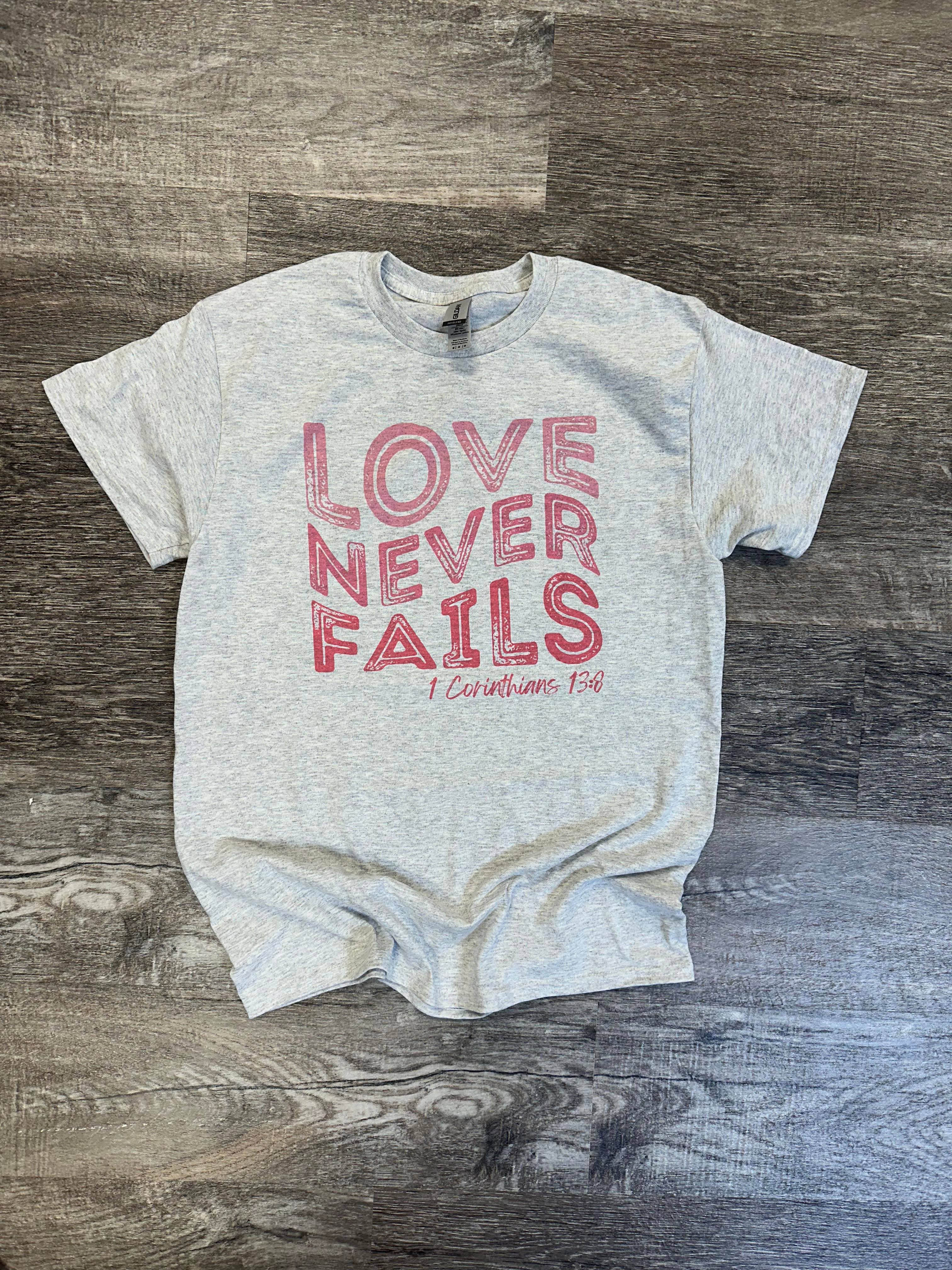 Love Never Fails - 1 Corinthians 13:8 - Ash Gray Tee