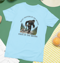 What Happens in the Woods... Bigfoot Tshirt (Light Blue)