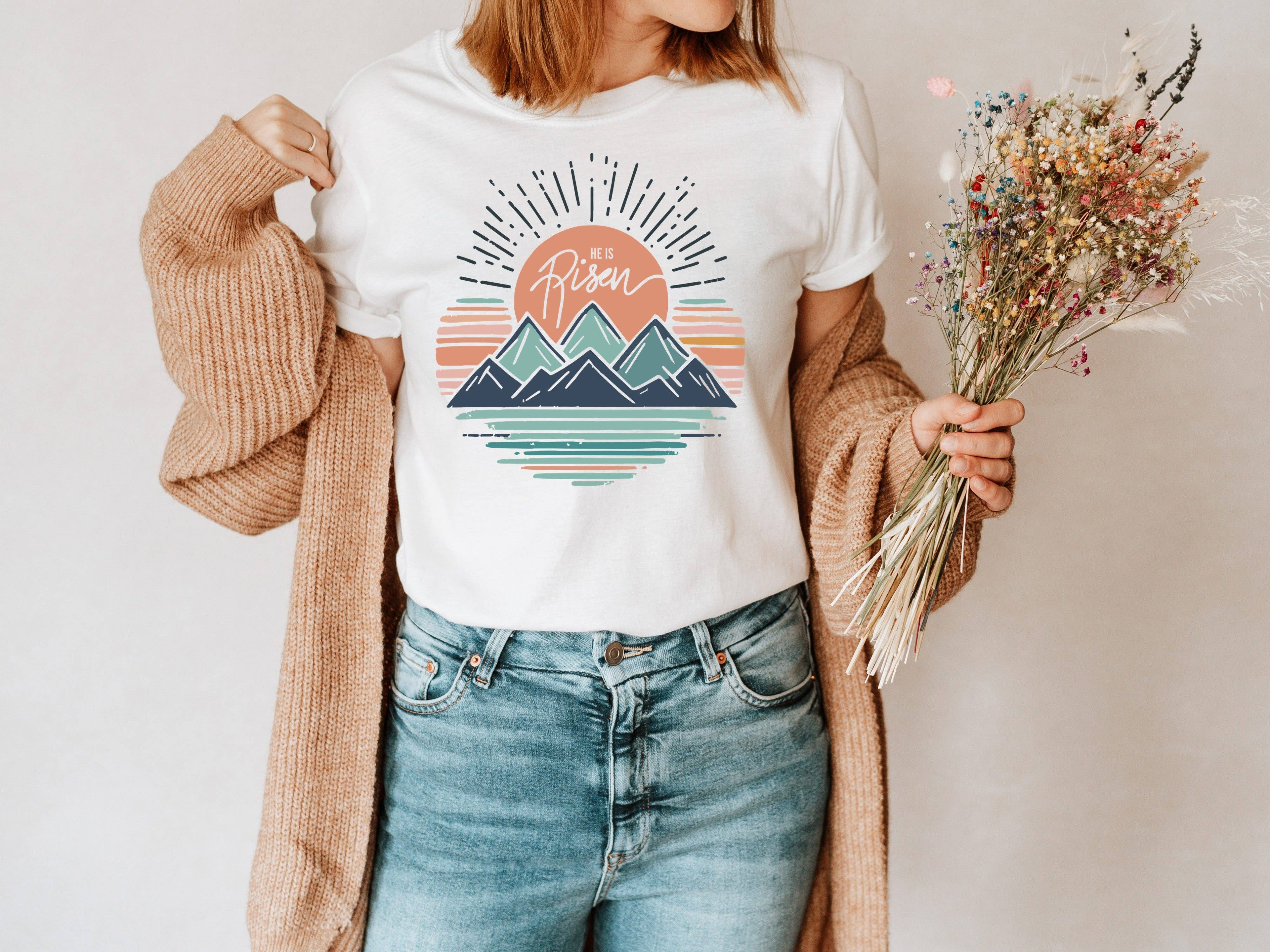 He Is Risen Mountains Easter Graphic Tee | Women's Tees