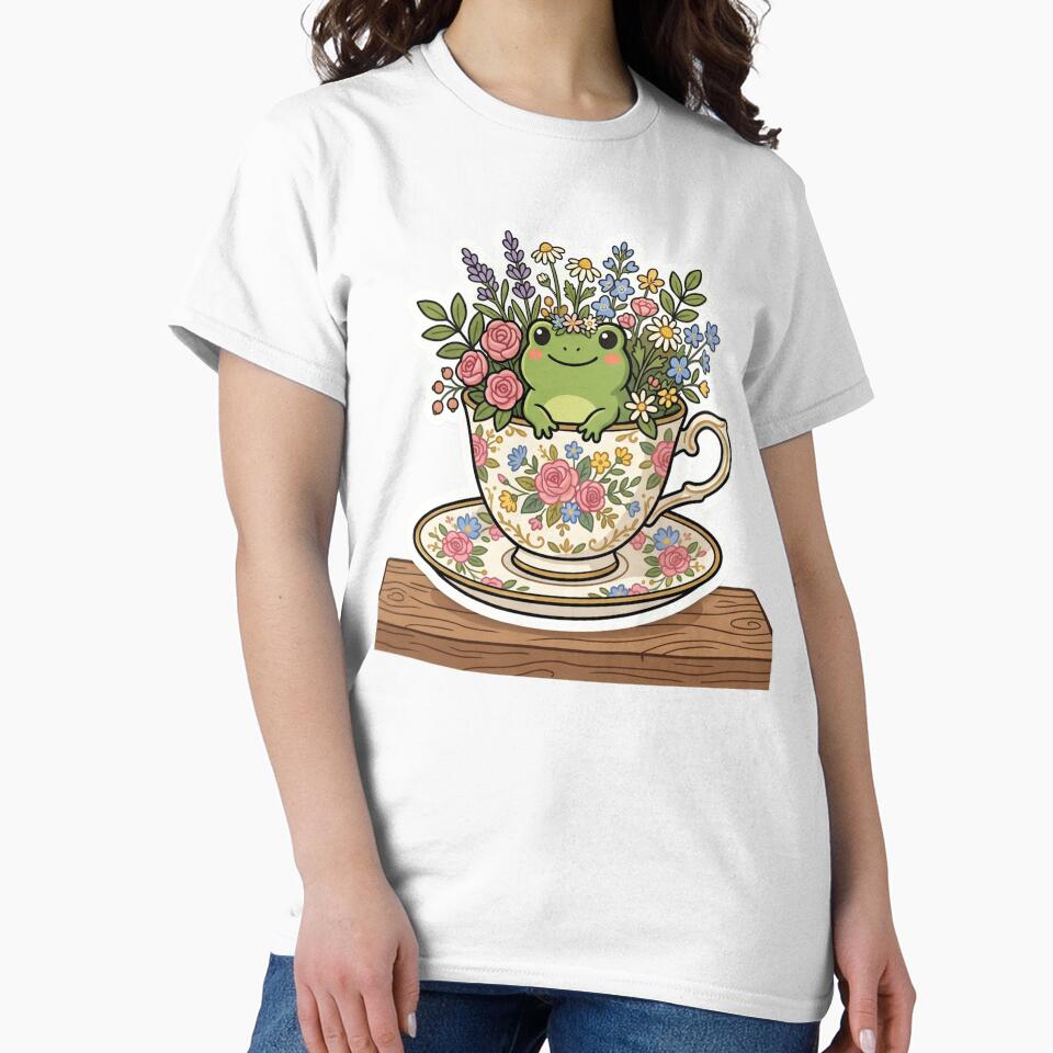 Frog sitting inside teacup with flowers, cozy cottagecore design by ArtsyExplorer